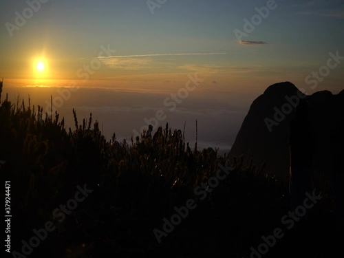 Sun rising, watching the sunrise high on the mountain