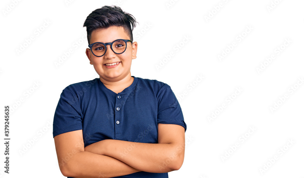 Little boy kid wearing casual clothes and glasses happy face smiling with crossed arms looking at the camera. positive person. Little boy kid wearing casual clothes and glasses happy face smiling with crossed arms looking at the camera. positive person.
