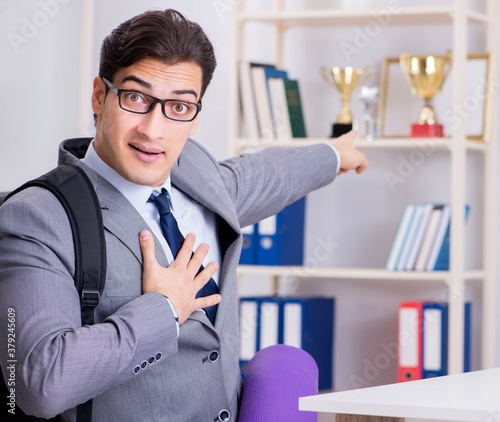 Young businessman rushing to sports gym during break