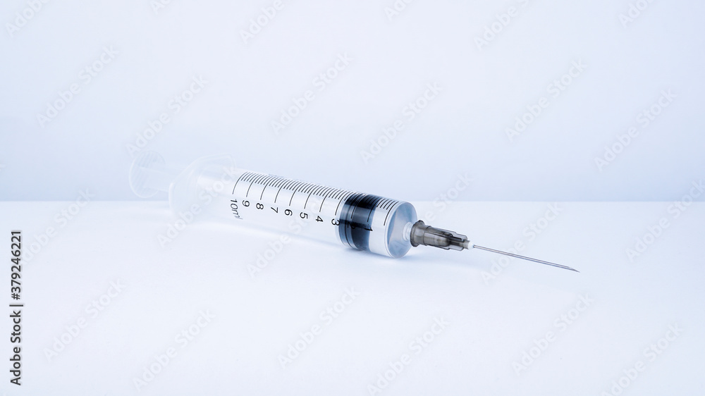 Syringe with liquid vaccine inside, prepare for injection. Syringe with liquid vaccine inside, prepare for injection.