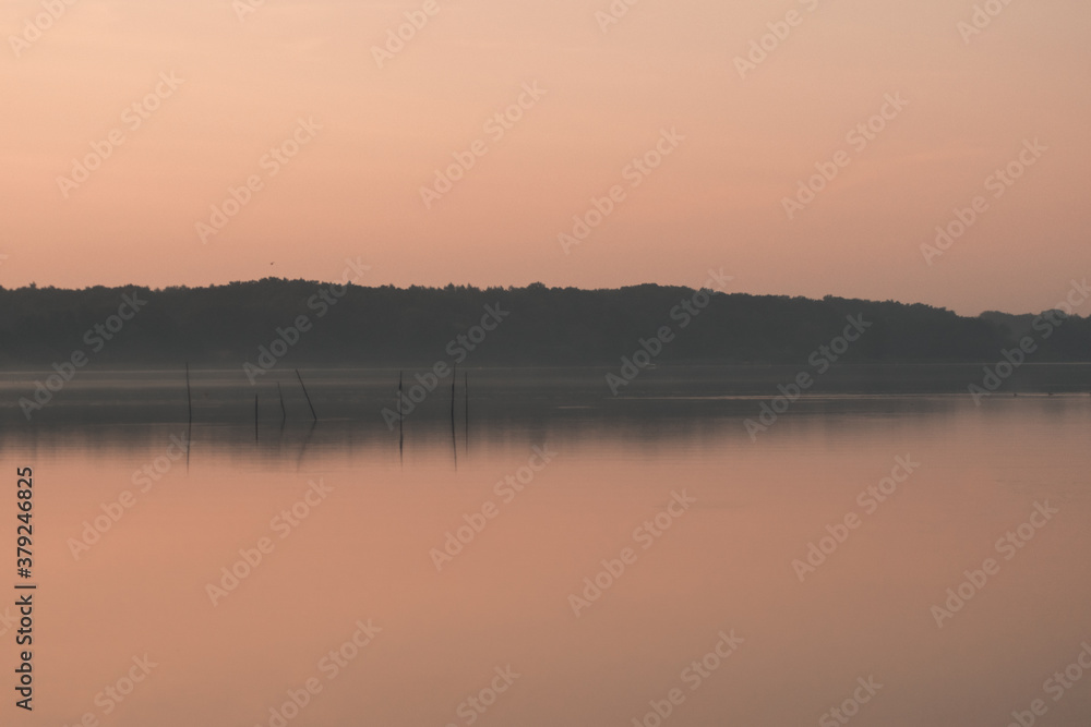 Great colourful sunrise on a calm lake Great colourful sunrise on a calm lake