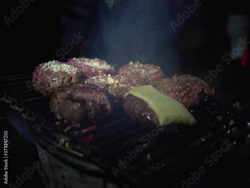 Roasting a tasty burger in camp
