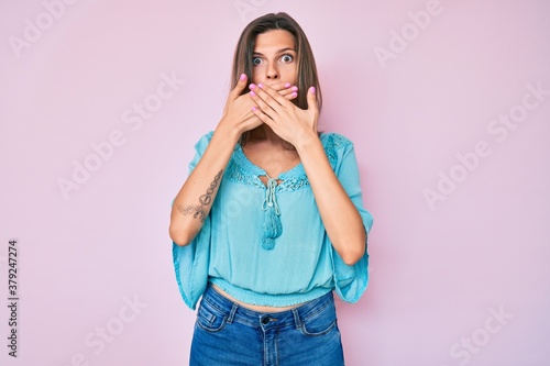 Beautiful caucasian woman wearing casual clothes shocked covering mouth with hands for mistake. secret concept.