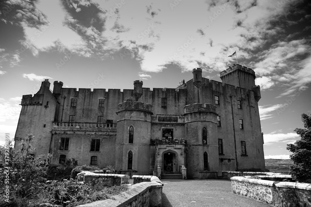 A monochrome image of a grand medieval Scottish castle.
