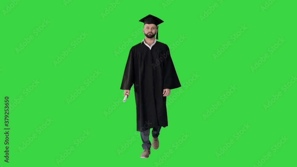 Excited graduate student walking with diploma on a Green Screen, Chroma ...