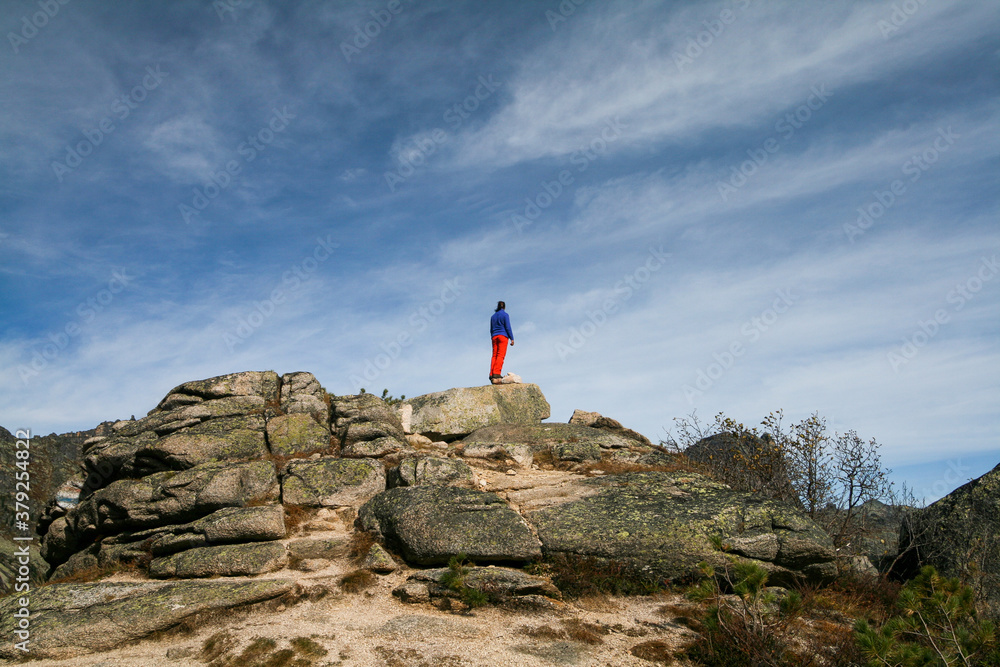 Tourist on top of a cliff, Ergaki, Russia.