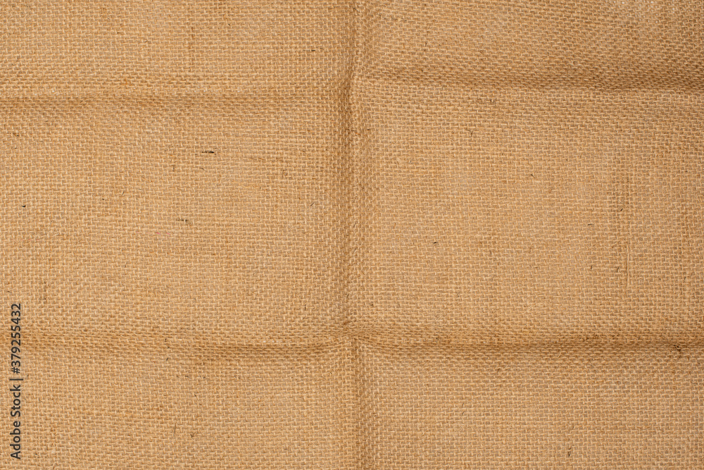 Fototapeta premium Burlap texture background. Jute burlap with wrinkled folds.