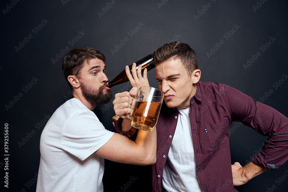 Two drunk friends drinking beer rest fun dark background Two drunk friends drinking beer rest fun dark background