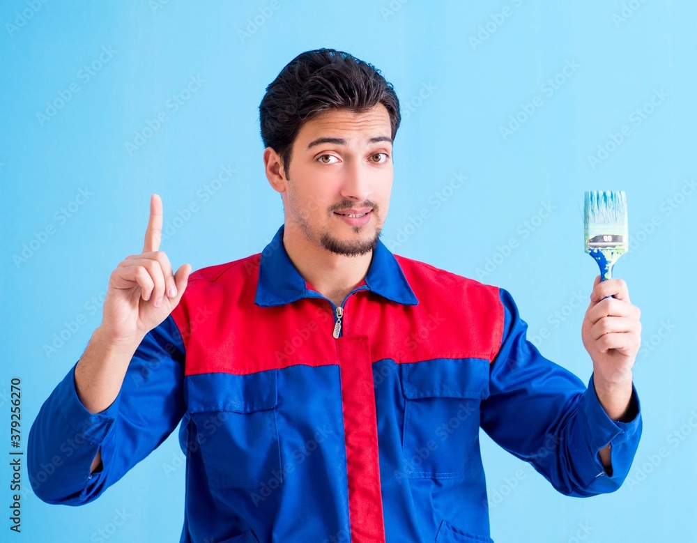 Young painter doing renovation at home Young painter doing renovation at home
