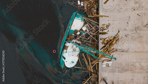 Shipwreck of a fishing boat in the beach in pensacola, florida after hurricane sally