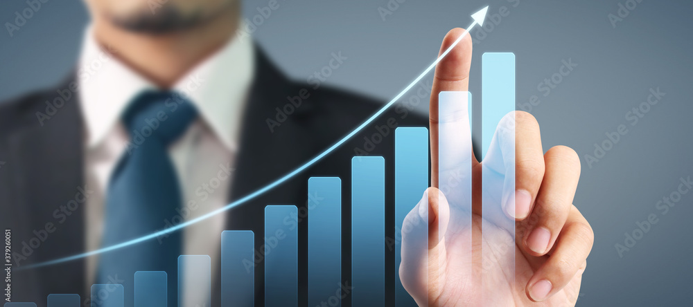 Businessman plan graph growth and increase of chart positive indicators in his business Businessman plan graph growth and increase of chart positive indicators in his business