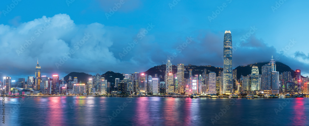 Panorama of Victoria harbor of Hong Kong city at dusk - obrazy, fototapety, plakaty 