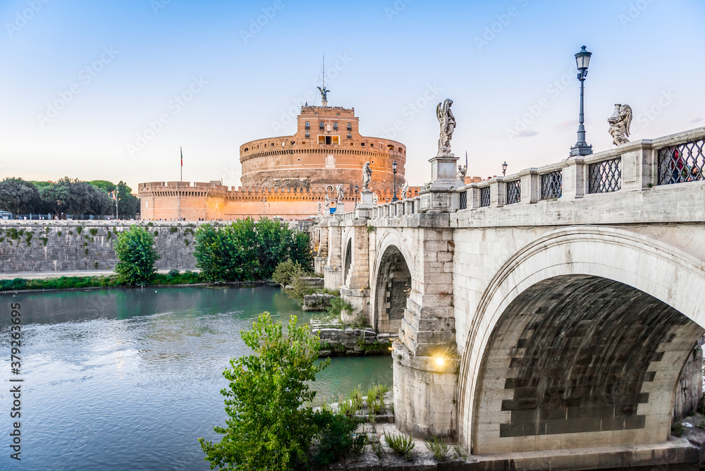 The bridge over the Tiber river and Castel Sant Angelo in Rome in the evening