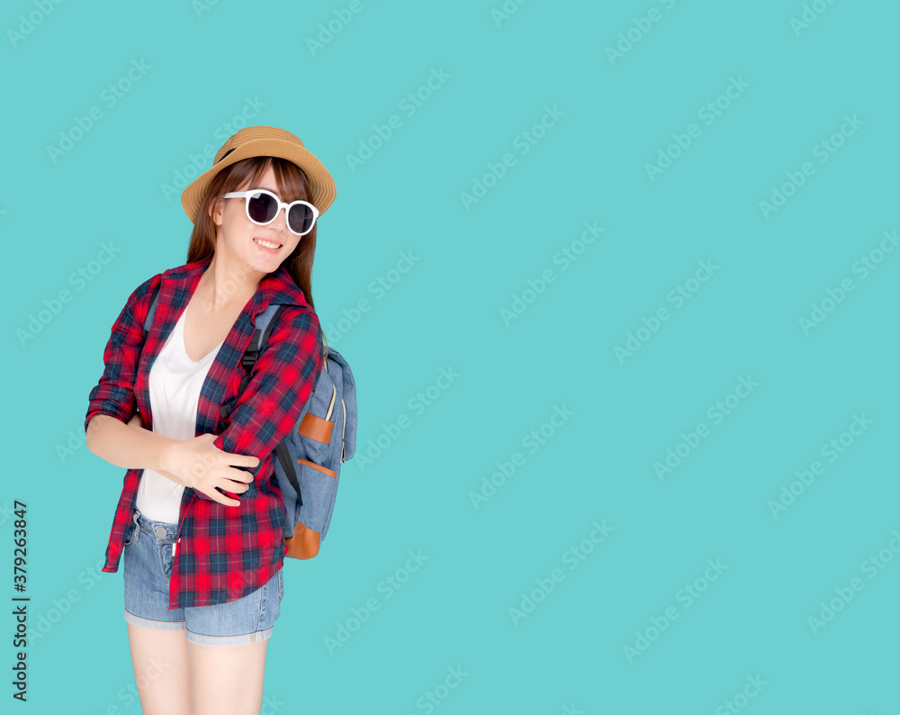 Beautiful portrait young asian woman wear sunglasses and hat smile excited and confident enjoy summer holiday isolated blue background, model girl cheerful having backpack in vacation, travel concept. Beautiful portrait young asian woman wear sunglasses and hat smile excited and confident enjoy summer holiday isolated blue background, model girl cheerful having backpack in vacation, travel concept.