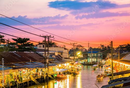 Floating market food at night in the river at Amphawa, Samut Songkhram Province, Thailand. The culture travel local boat in canal water. The Asia tourism concept