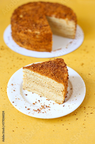 slice of honey cake on yellow background