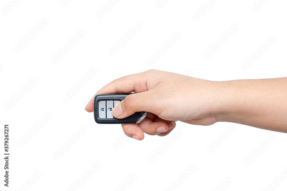 Young woman opening her luxurious car door the modern control remote keys isolated on white background. Hand is locking the automobile with the security system. Young woman opening her luxurious car door the modern control remote keys isolated on white background. Hand is locking the automobile with the security system.