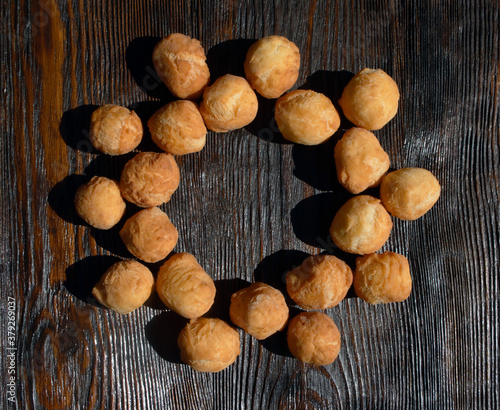  fresh balls made of dough lie on a wooden background