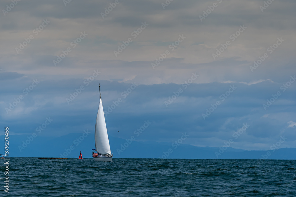 Beautiful and peaceful sailboat sailing in the middle of the Pacific Ocean 
