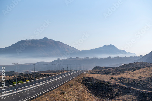 Landscape highway at morning. air pollution from vehicles and heavy industry. smoke and fog photo