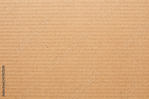 Cardboard sheet texture background, detail of recycle brown paper box pattern.