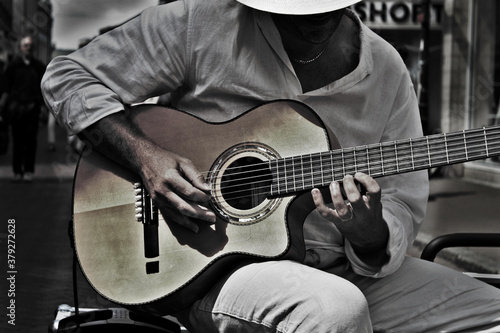 musician playing music in the streets.
