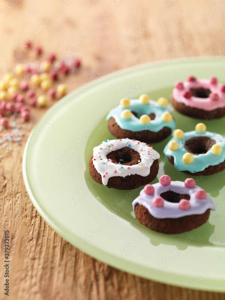 colorful icing donuts on plate