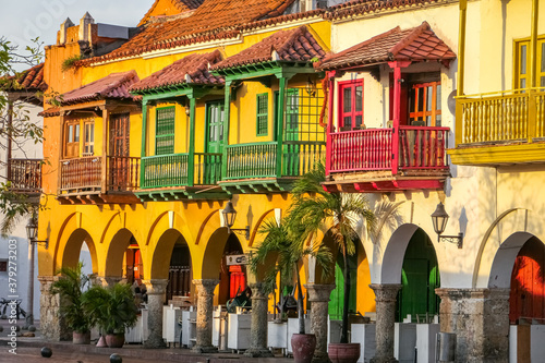 Close top view to colorful historical buildings with balconies and arches in warm sunlight, Plaza de los Coches (Carriage Square), Cartagena, Unesco World Heritage
 photo