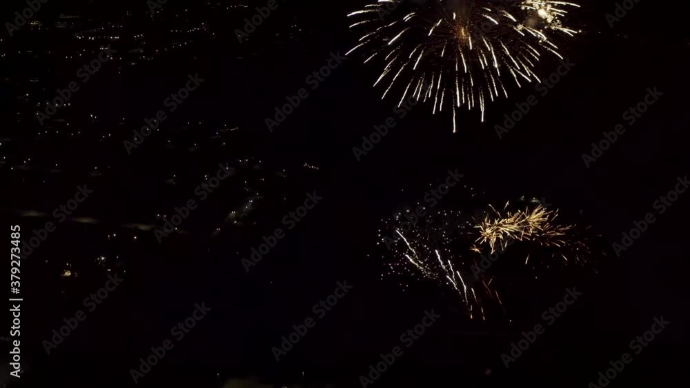 Aerial shot of fireworks with city lights in the background. City Night Lights. 4K footage. Aerial shot of fireworks with city lights in the background. City Night Lights. 4K footage.