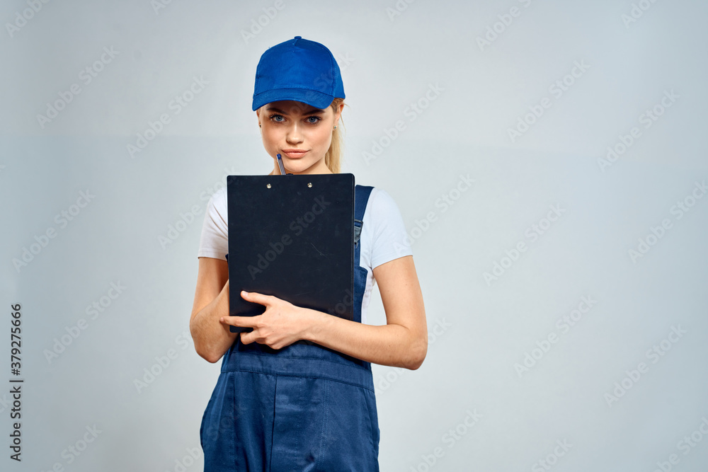 Working woman in uniform courier delivery service documents Working woman in uniform courier delivery service documents