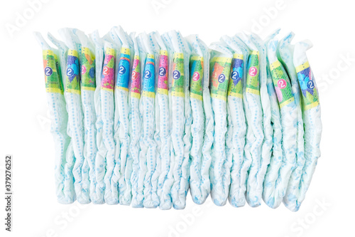 Stack of newborn baby diapers isolated on white background. 