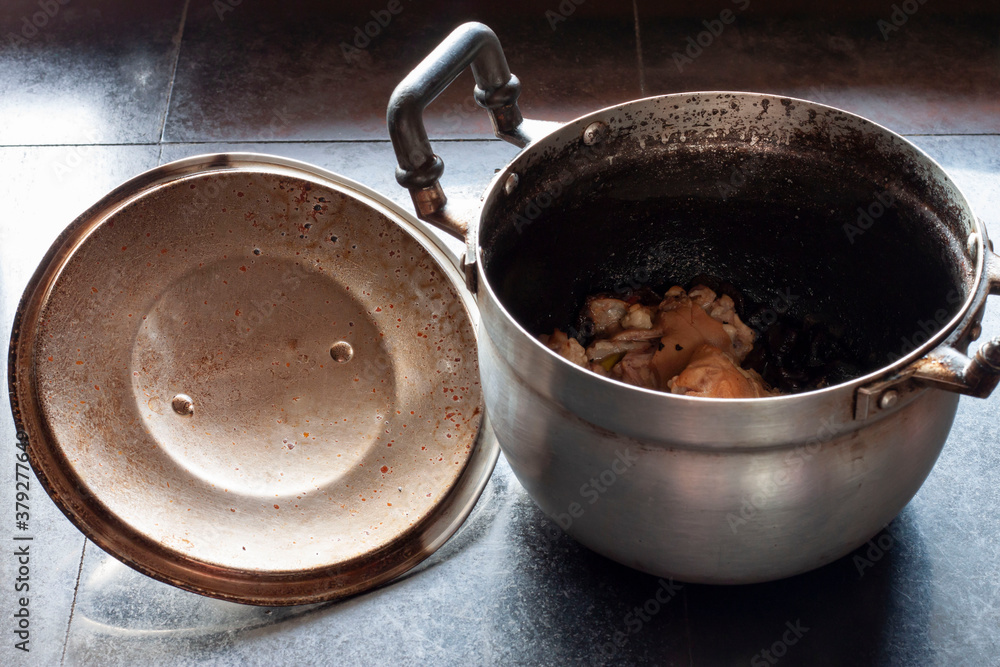 Pot of boiled pork bone soup burning until the water is dry and burnt. Pot of boiled pork bone soup burning until the water is dry and burnt.