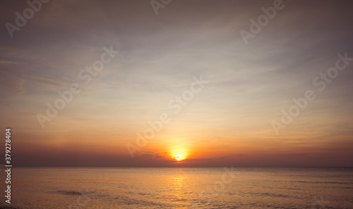Beautiful golden sunset with blue sky over the horizon on the beach background, Thailand. Tropical twilight colorful sunrise from the landscape sea. Summer ocean vacation concept.