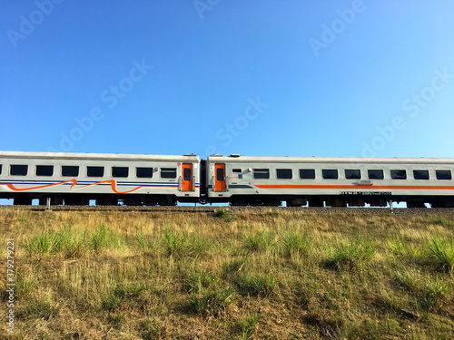 Yogyakarta, Indonesia - September 18, 2020: Indonesian trains cross the countryside in Kulon Progo