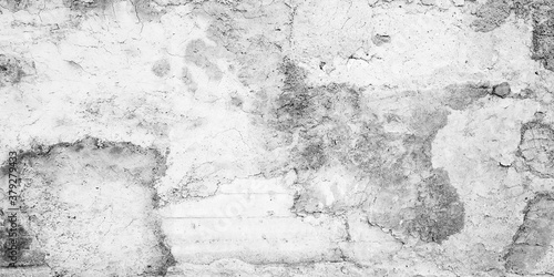 Grungy white concrete wall with stucco texture © evannovostro