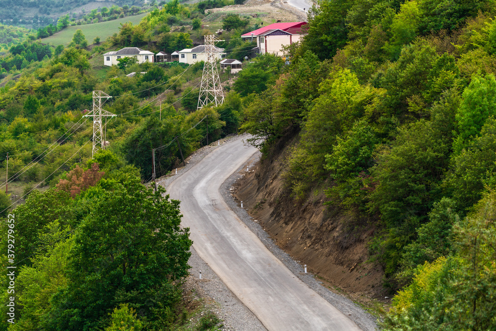 Empty winding road along the mountains Empty winding road along the mountains