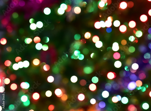 Bokeh Blur Christmas lights on Christmas Tree with bokeh beautiful background for design and decoration  new year concept  selective focus.