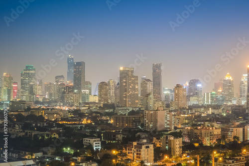 Aerial view of the modern buildings and skyscrapers at night of Bangkok City  Thailand.