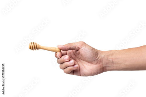 man hand holding a wooden honey isolated on a white background