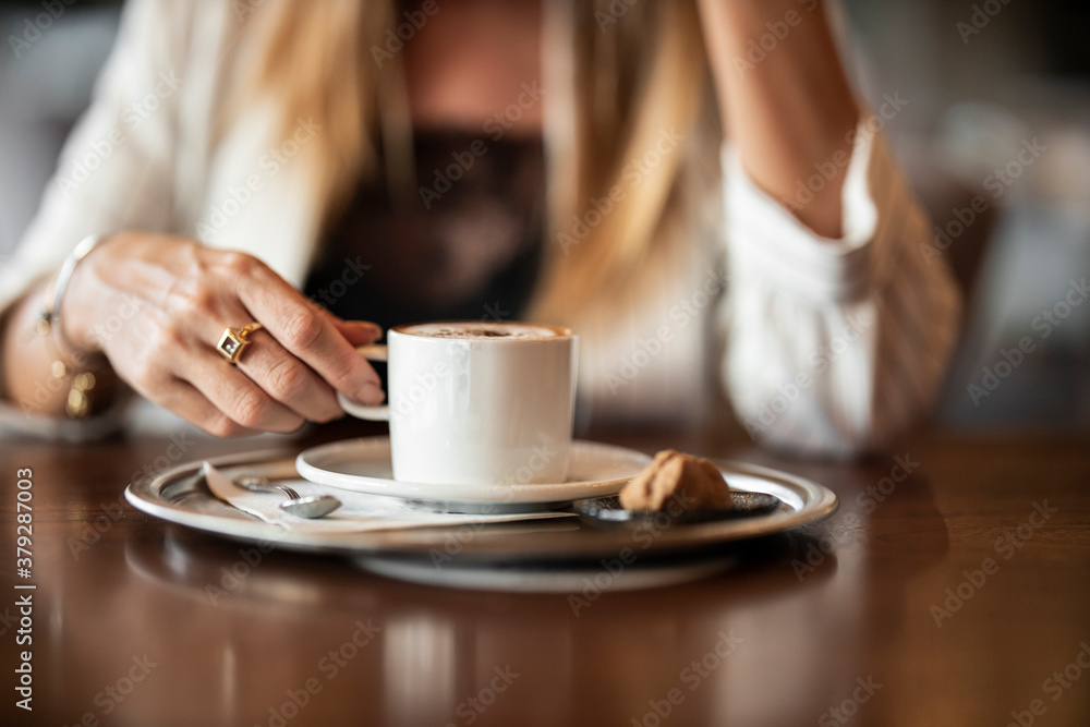 a woman drinking latte coffee in cafe a woman drinking latte coffee in cafe