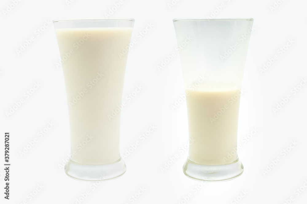 Two glass of fresh milk drink isolated on white background. Milkshake cut out. Two glass of fresh milk drink isolated on white background. Milkshake cut out.