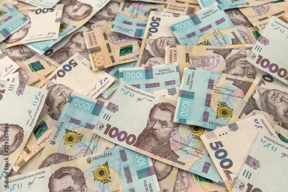 seamless texture of real new ukraine 500 and 1000 banknotes. Pile of hryvnia as financial background.