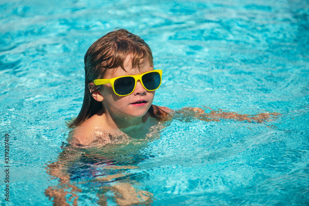 Kid having fun in swimming pool. Kid in sunglasses relax on beach.