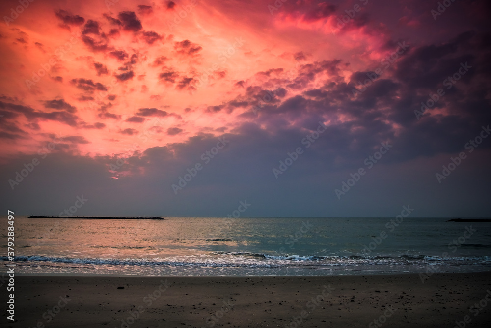 Beautiful golden sunset with blue sky over the horizon on the beach, Thailand. Tropical colorful sunrise from the sea. Beautiful golden sunset with blue sky over the horizon on the beach, Thailand. Tropical colorful sunrise from the sea.
