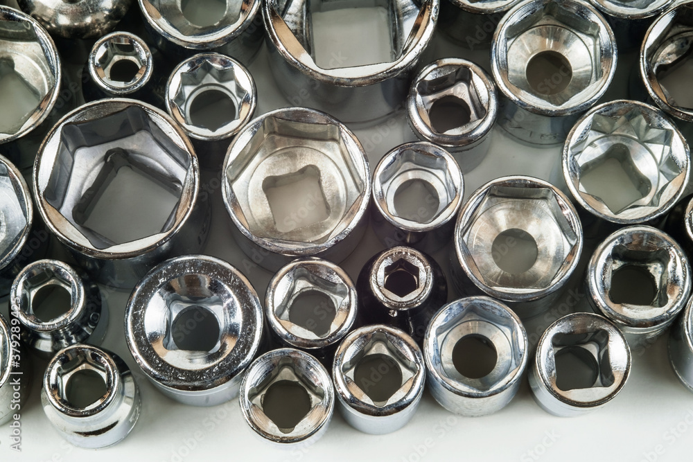Various different size metal wrench heads closeup. Set of wrench heads collection on the white background Various different size metal wrench heads closeup. Set of wrench heads collection on the white background