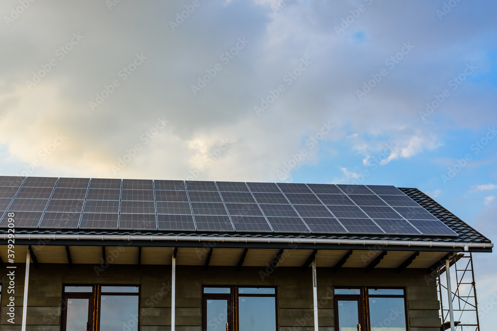 Solar panels on roof of residential house. Clean energy. Ecological concept Solar panels on roof of residential house. Clean energy. Ecological concept