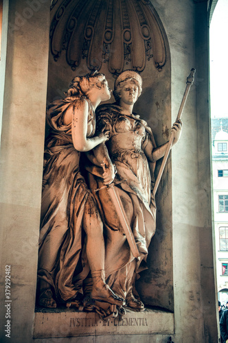 Wien, Austria - The allegoric statue symbolizes the Maria Theresa’s motto ‘Justitia et Clementia’, meaning ’Justice and Clemency’ in Hoburg palace