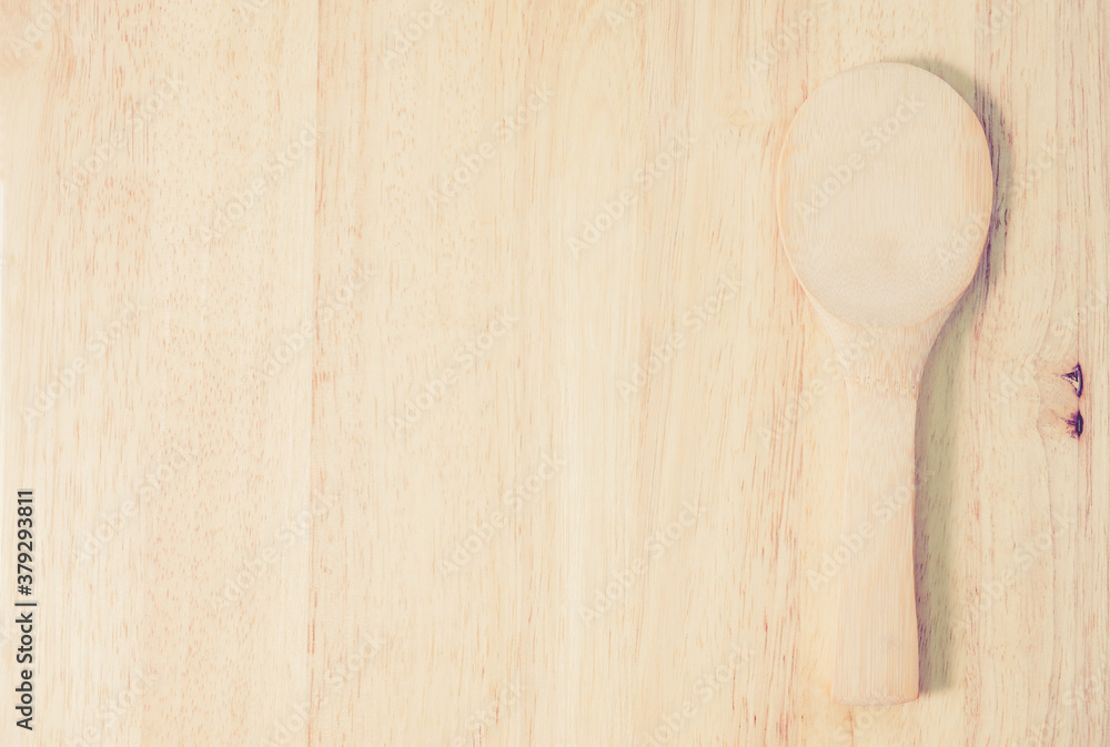 Wooden spoon on rustic wood background. View from above Wooden spoon on rustic wood background. View from above