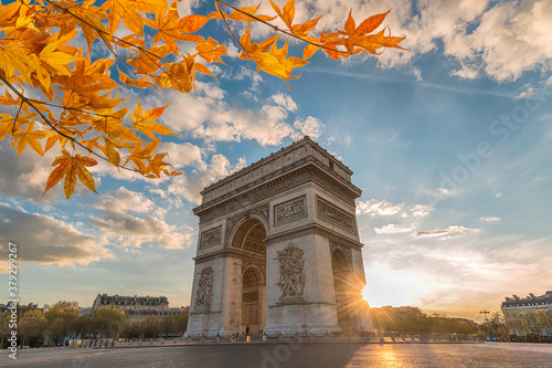 Paris France sunset city skyline at Arc de Triomphe and Champs Elysees with autumn leaf foliage