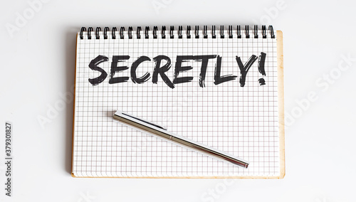 Wallpaper Mural Word Writing Text SECRETLY on notepad . business concept . Torontodigital.ca
